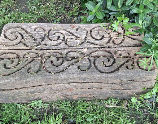 Wood block decorated with Nga Hau e Wha symbol, South Seas Garden, Pannett Park, Whitby