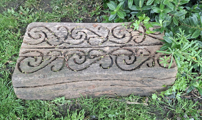 Wood block decorated with Nga Hau e Wha symbol, South Seas Garden, Pannett Park, Whitby