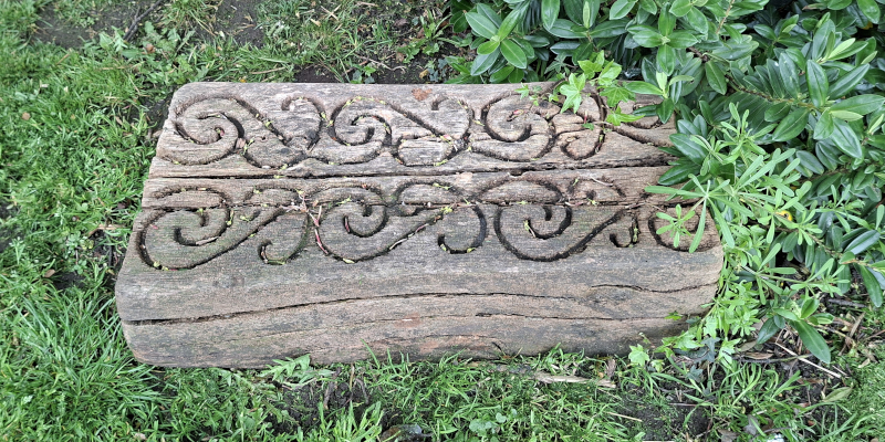 Wood block decorated with Nga Hau e Wha symbol, South Seas Garden, Pannett Park, Whitby